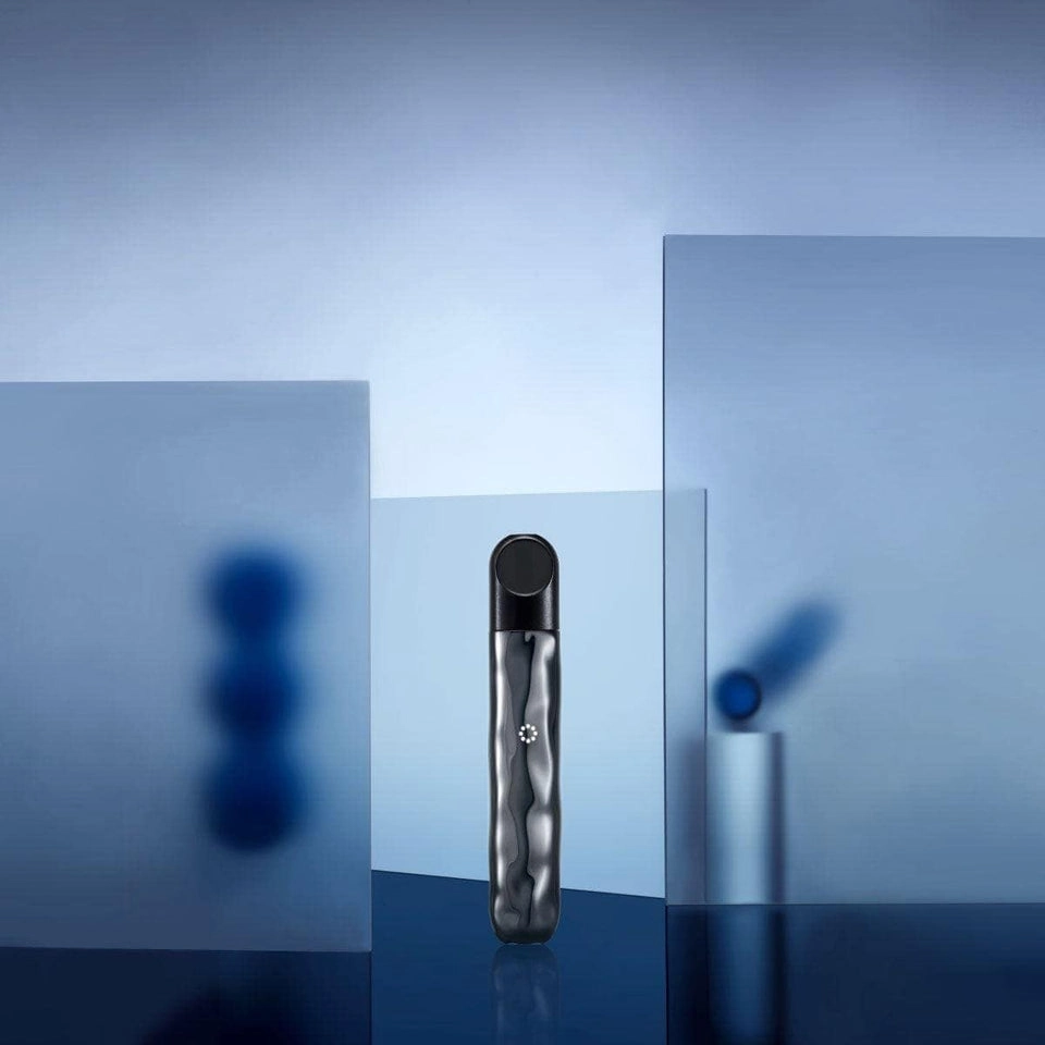 user enjoying bundaberg tobacco flavoured vape in outdoor setting